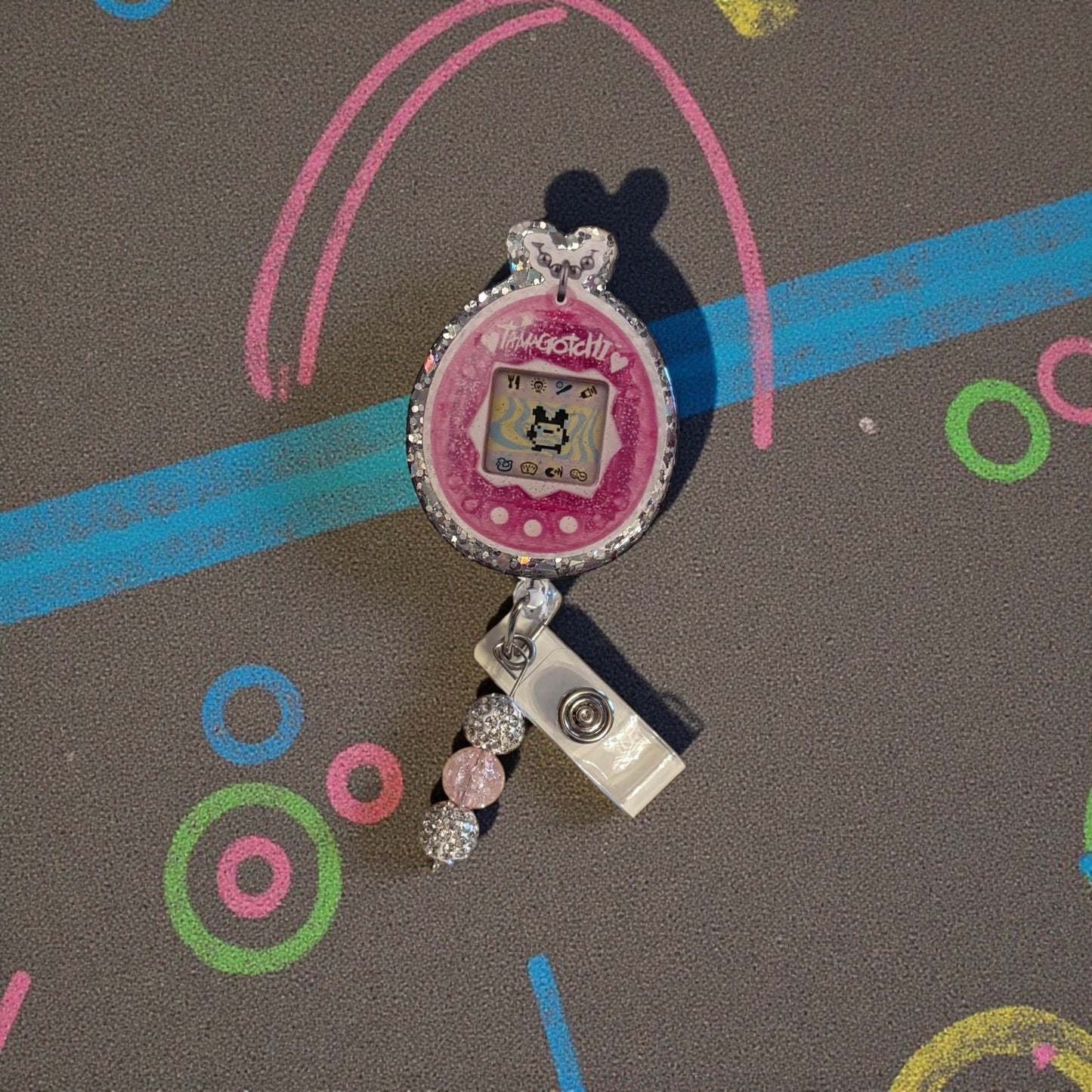 Tamagotchi-Inspired Retro Badge Reel