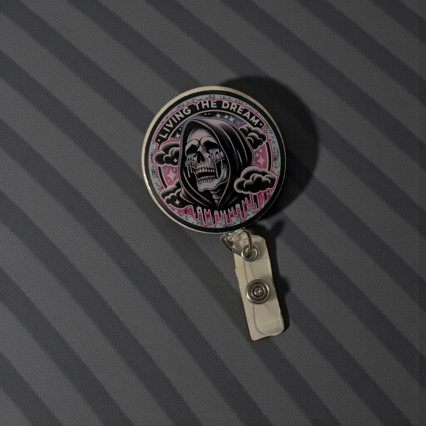Living the Dream Badge Reel – Funny Skeleton Retractable ID Holder with Pink Drip Design