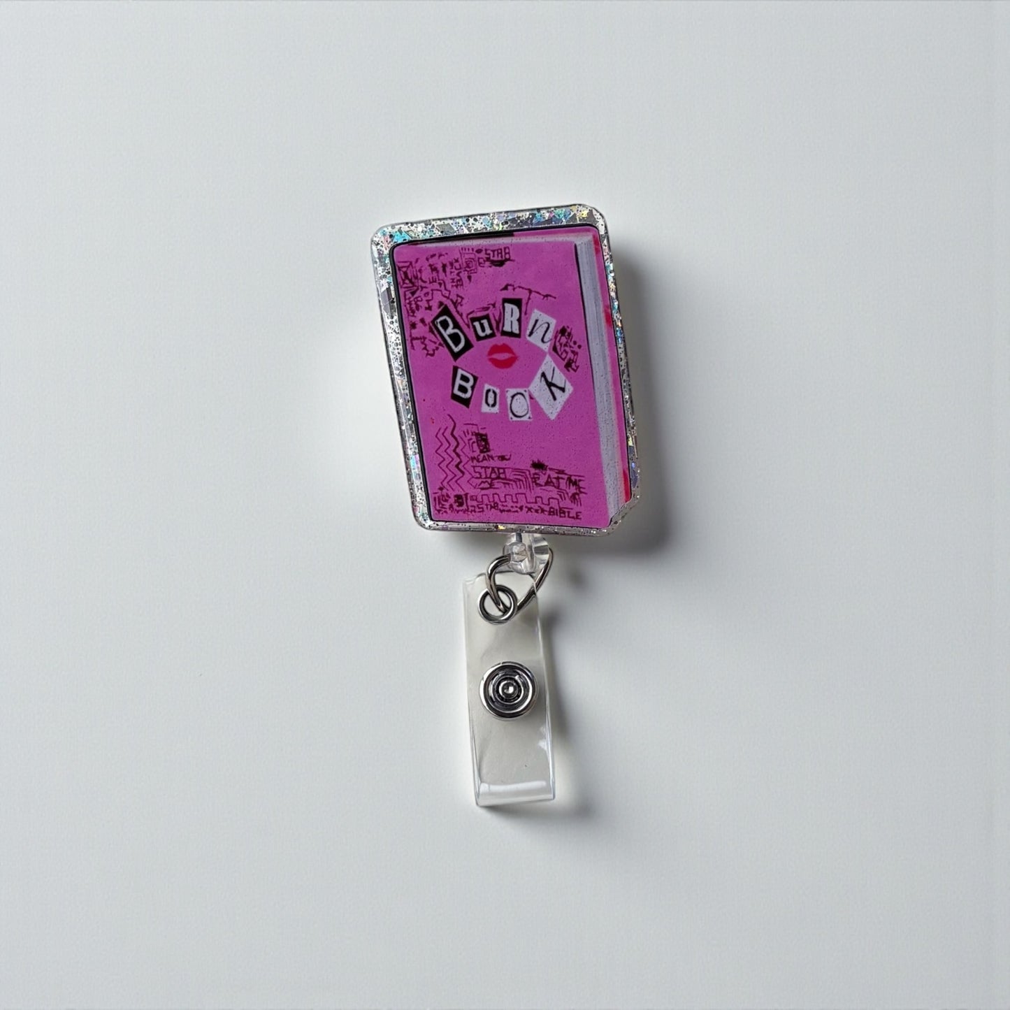 Burn Book Badge Reel – Mean Girls Nostalgia, Glitter Border, Retractable ID Holder