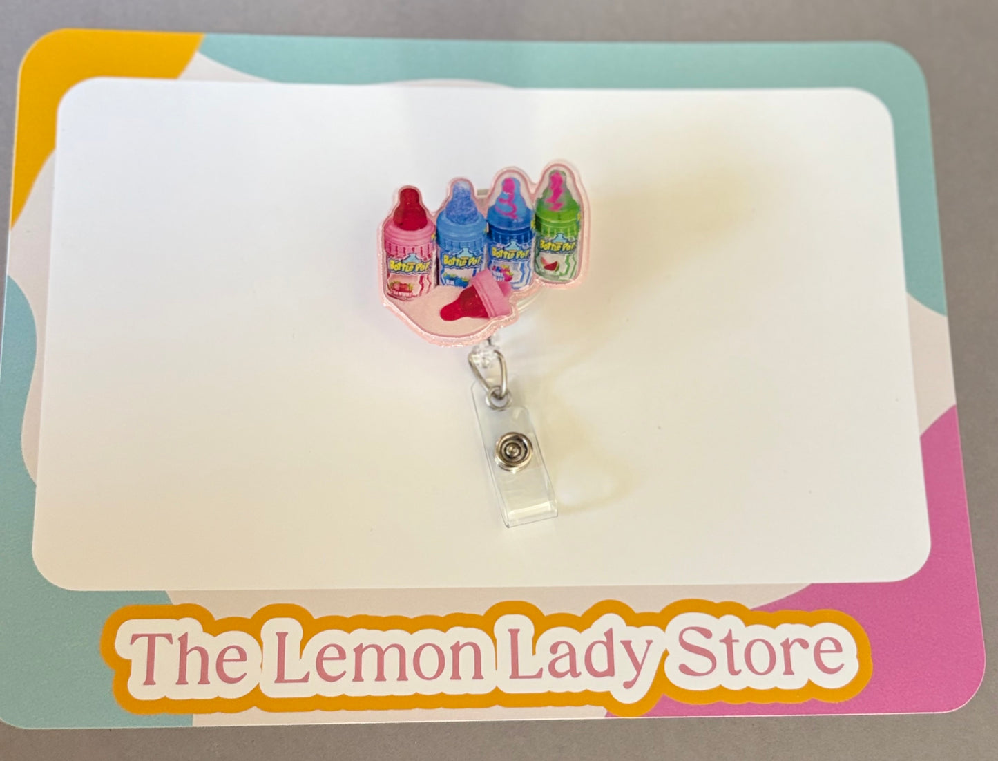 Retro Baby Bottle Pop Badge Reel – Nostalgic Candy ID Holder | Fun Badge Clip for Nurses & Teachers